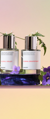 2 perfumes bottles with flowers
